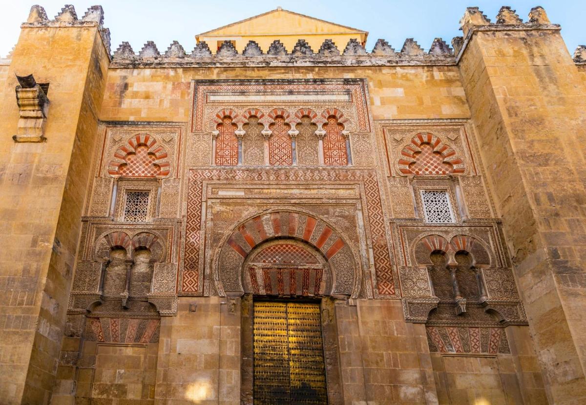 an entrance to a building with a gold door