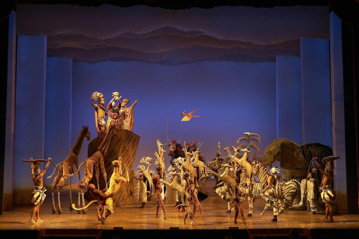 a group of people dancing on a stage