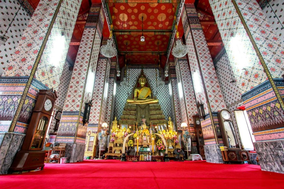 a large temple with a large statue in the middle