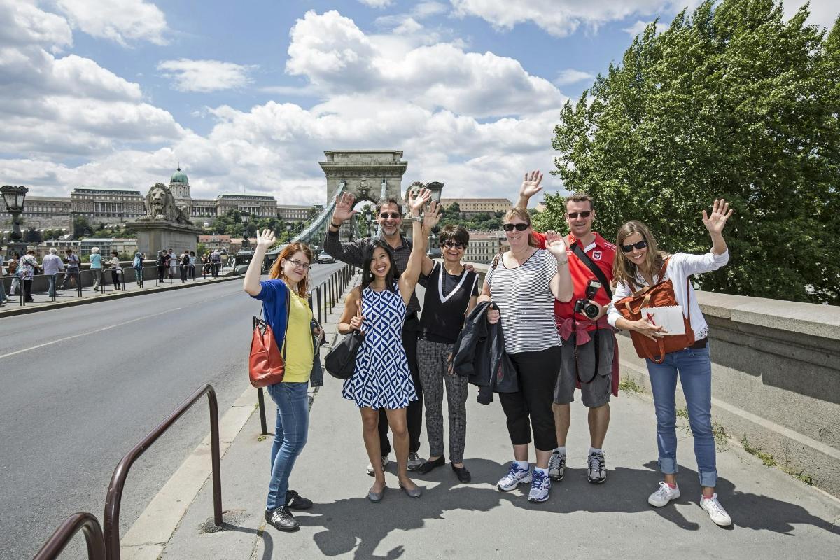 a group of people standing on the side of a road
