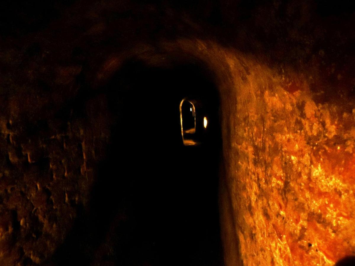 a close up of a hole in an orange object