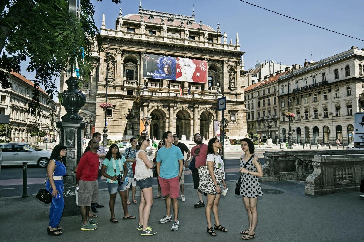 a group of people standing in front of a building