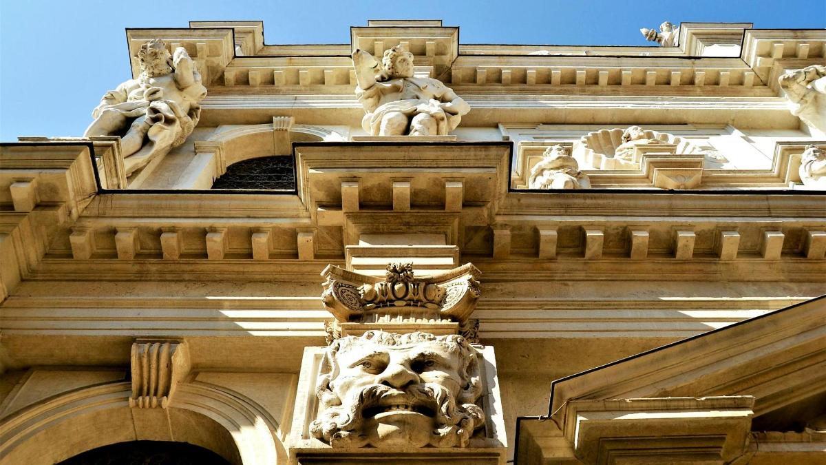 a building with sculptures on the side of it