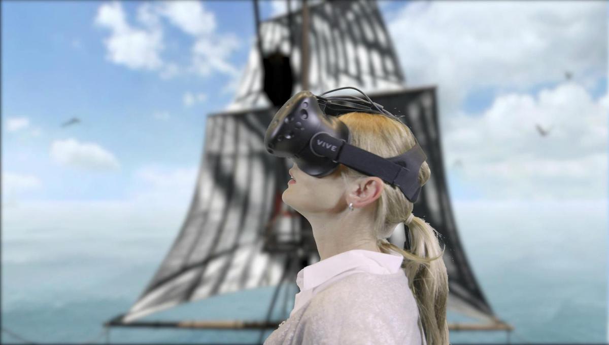 a woman wearing a virtual reality headset in front of the eiffel tower