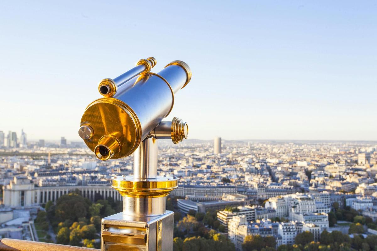a street light on top of a city