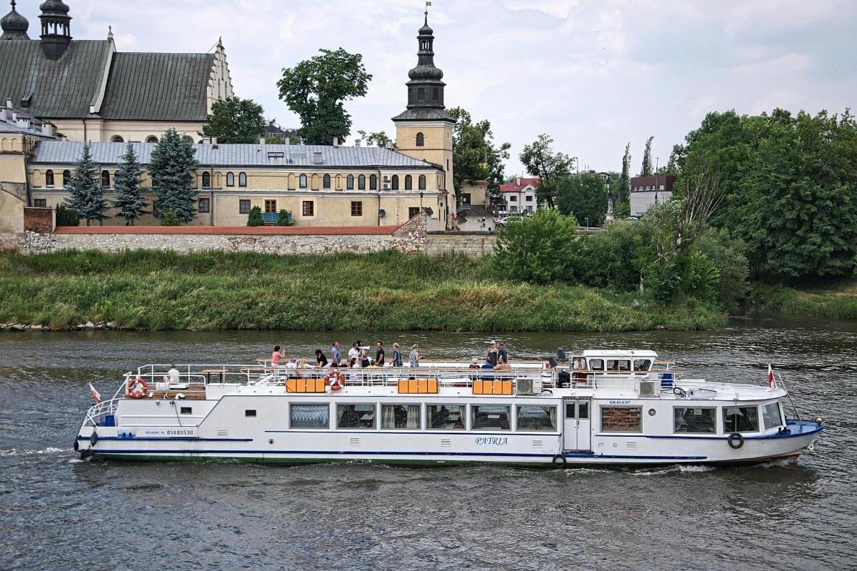 a boat on a river with people on it