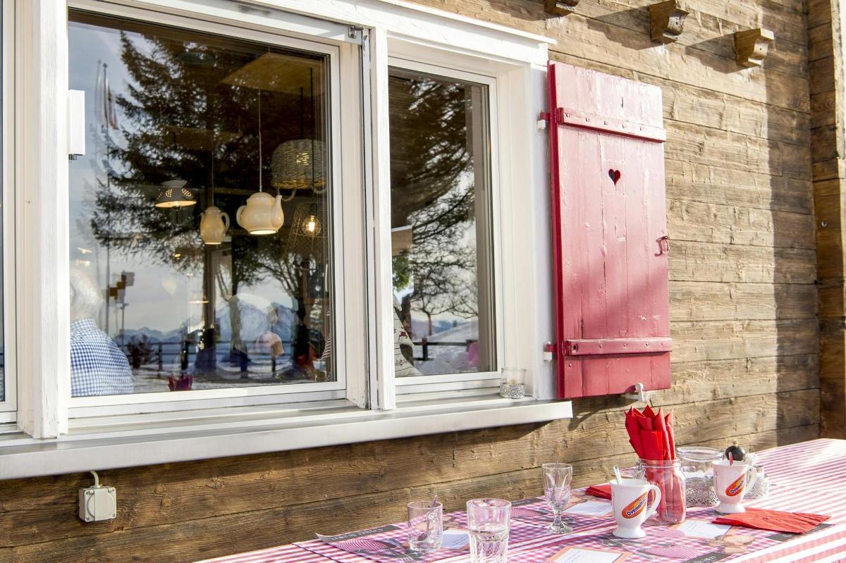 a table with a table cloth and a window