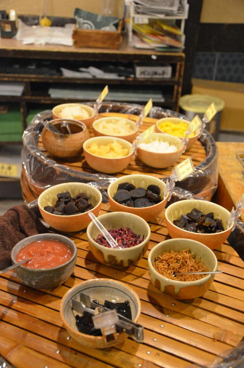 a table with bowls of different types of food