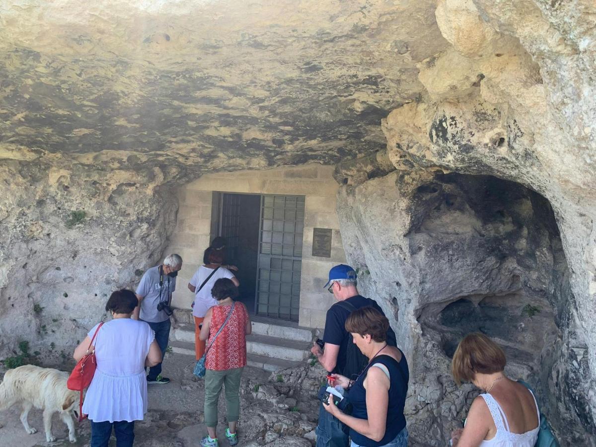 a group of people standing in a cave