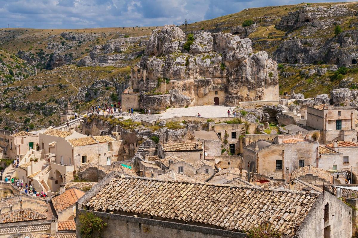 an overview of the village of positano with mountains in the background