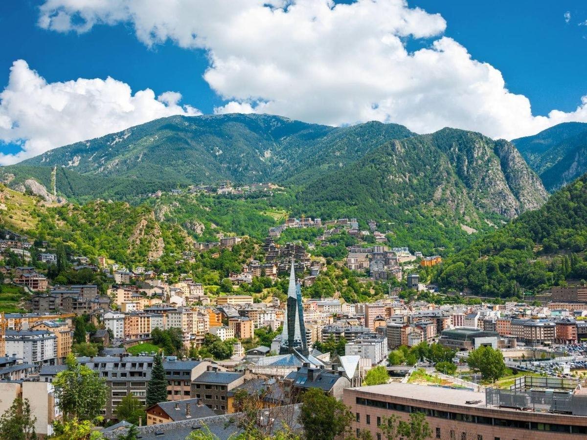 a view of a city with mountains in the background