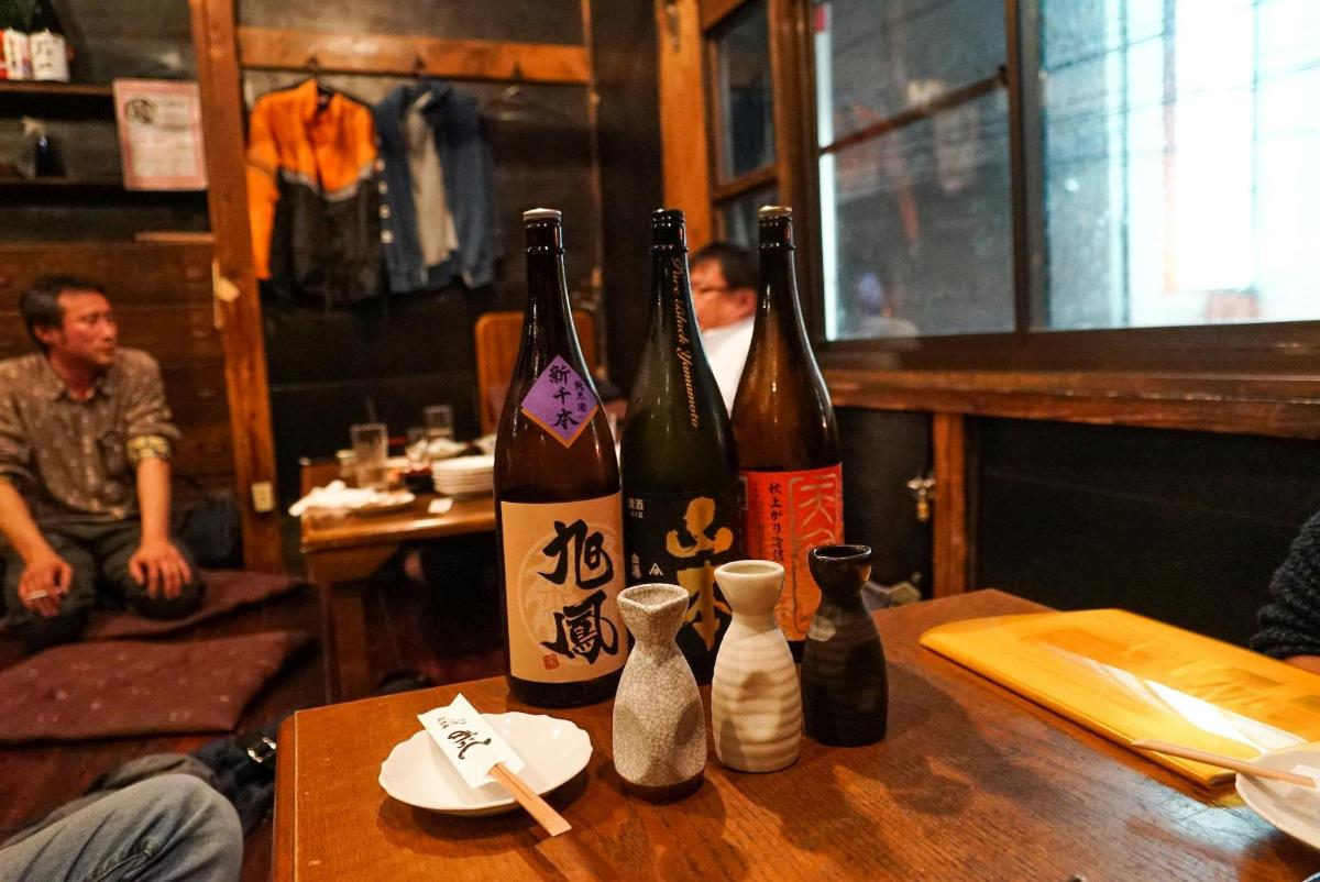 three bottles of wine sitting on top of a table