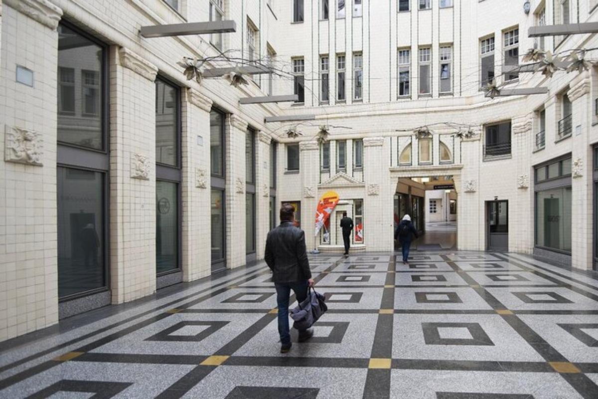a man walking down a street in a building