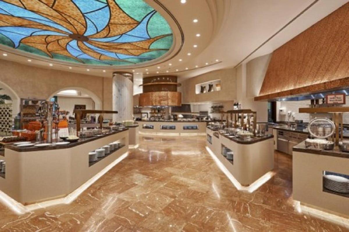 a large kitchen with a large stained glass window