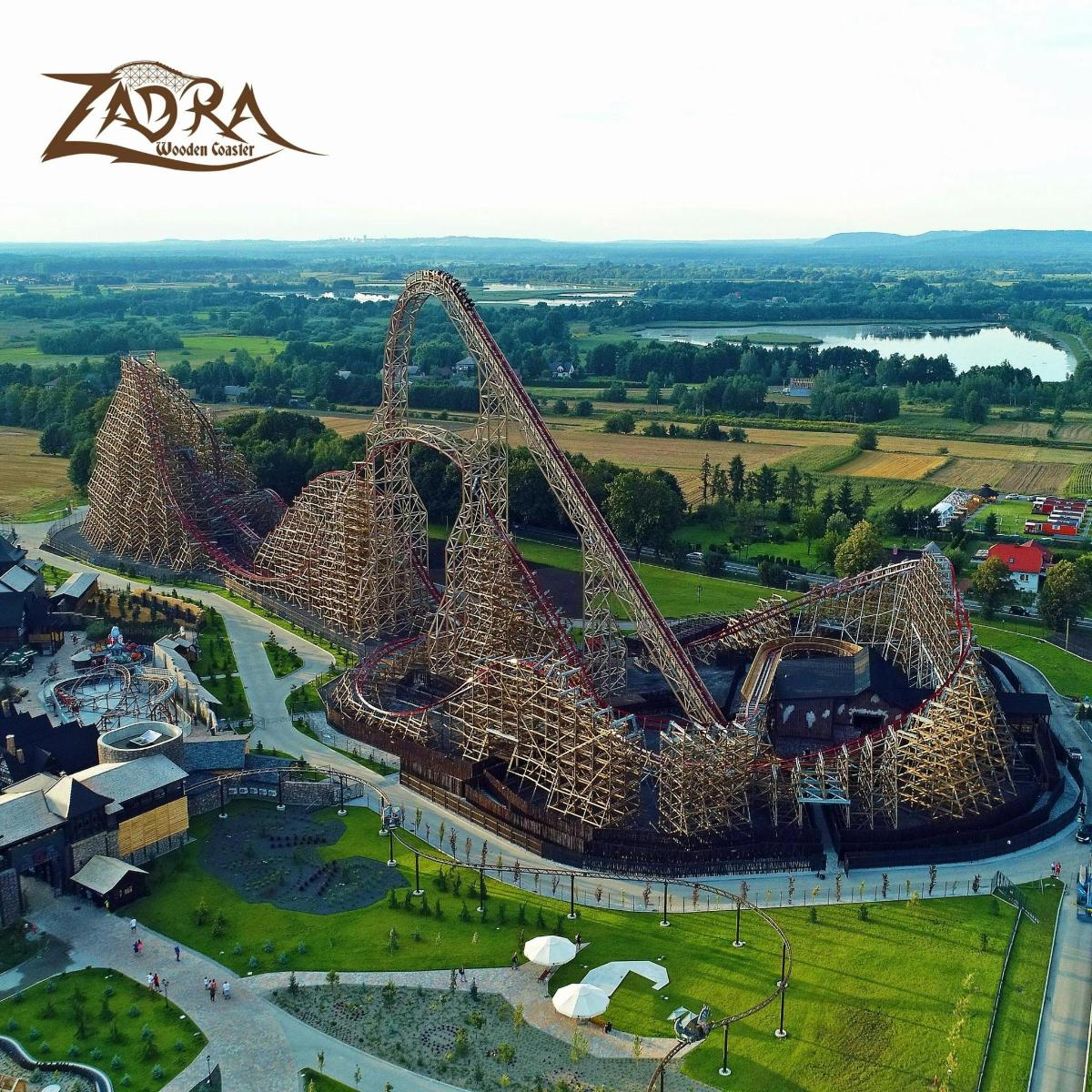 an aerial view of a roller coaster at an amusement park