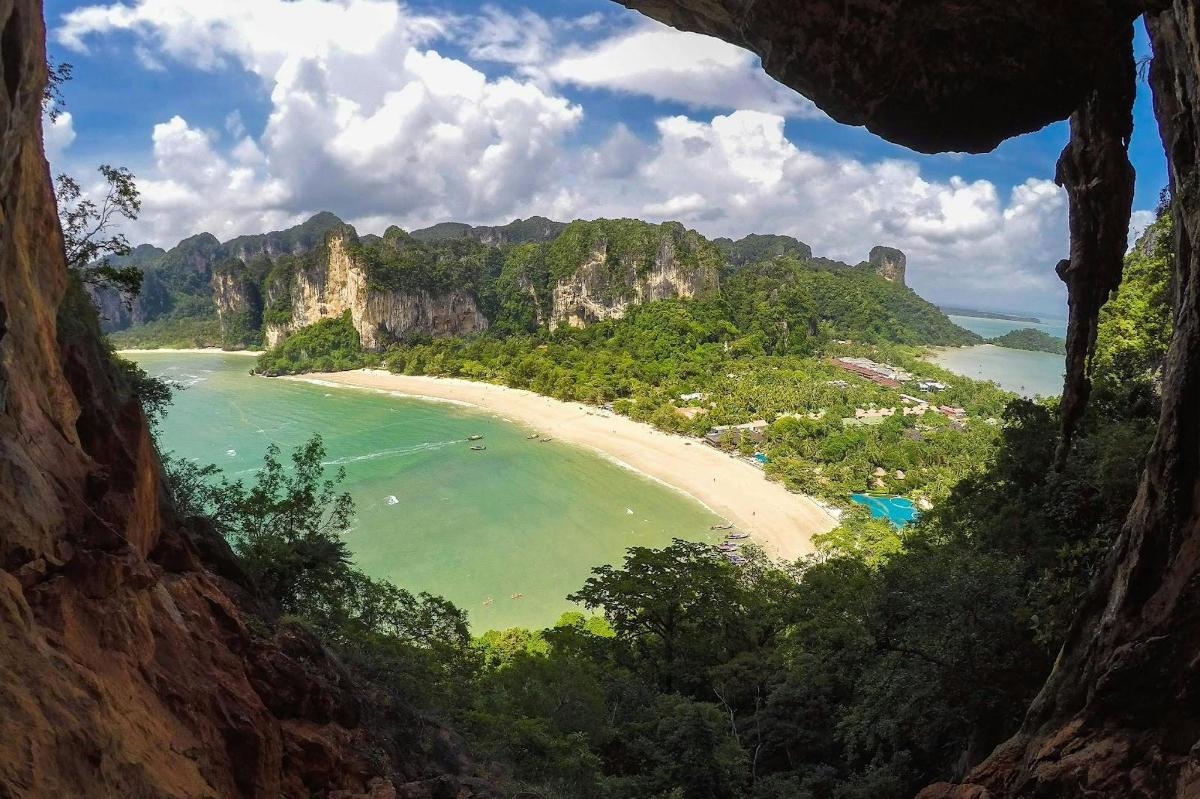 a view of a beach from a cave