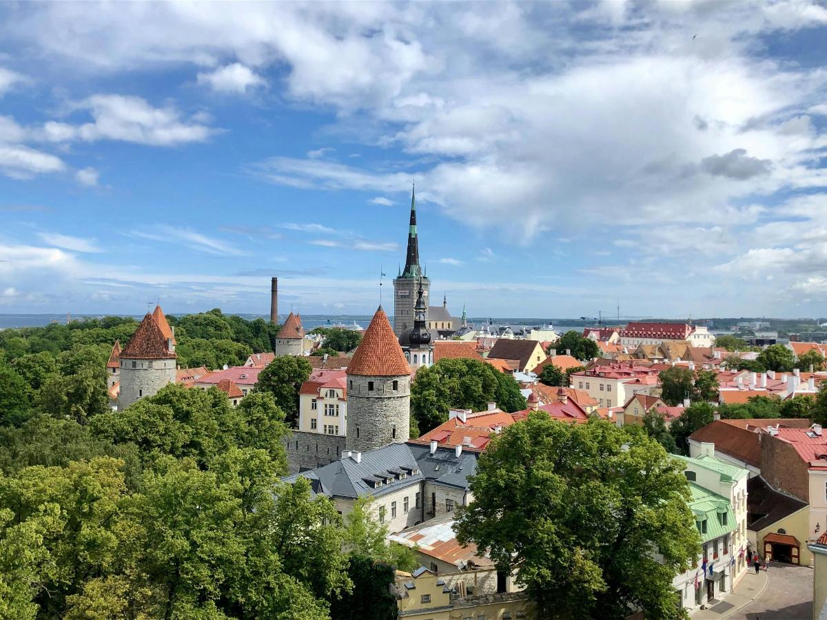 a view of a city with buildings and trees