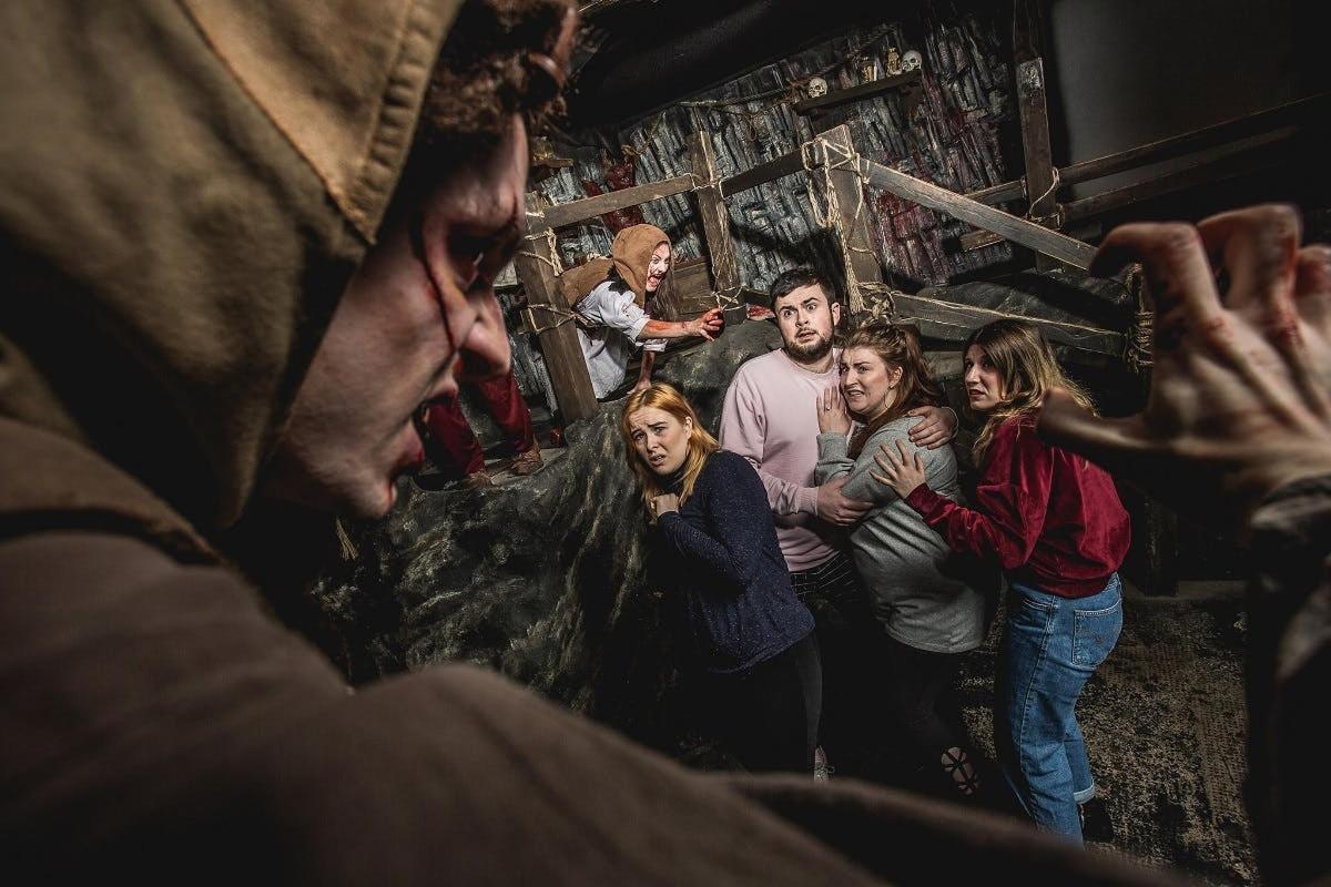 a group of people standing in a room