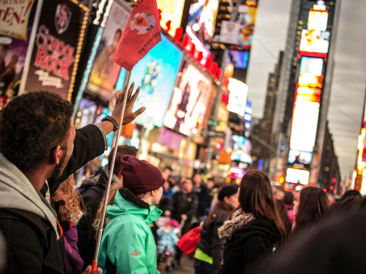 a crowd of people on a busy city street