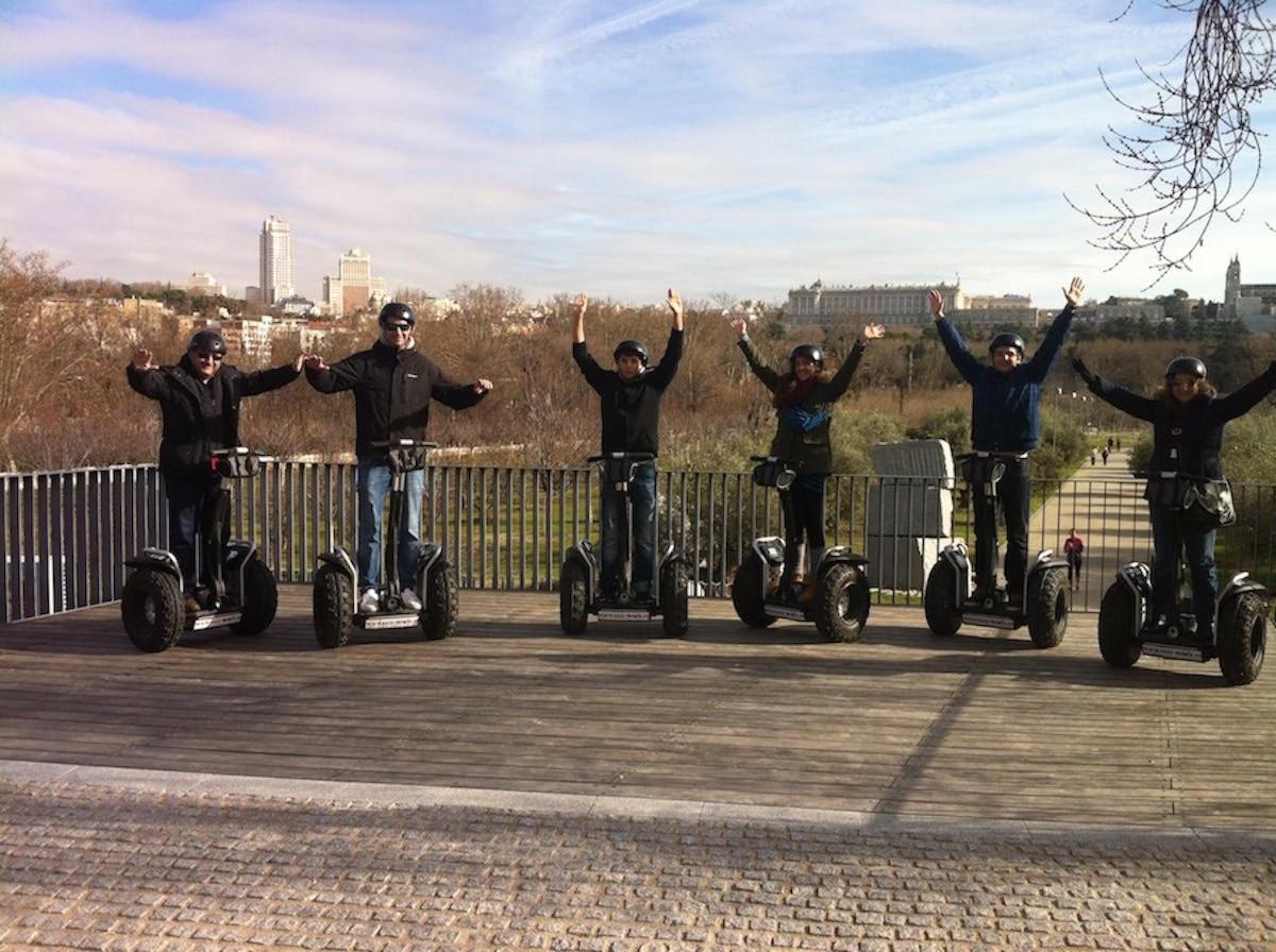 a group of people riding on segways