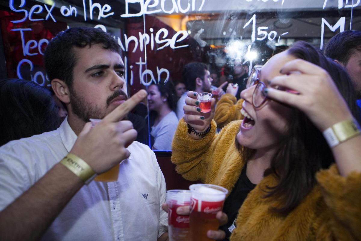 a group of people drinking beer at a party