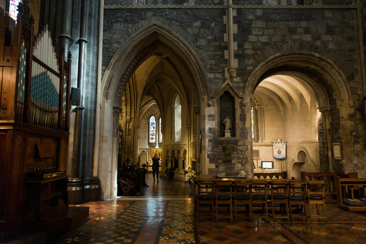 a large cathedral with pews in a building