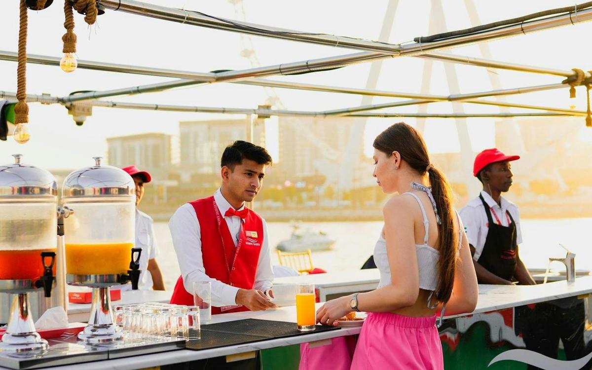 a man and a woman standing in front of a bar