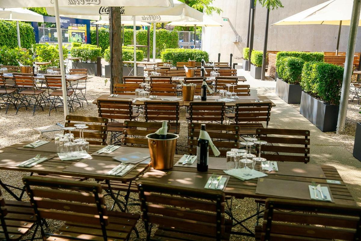a row of tables and chairs at a restaurant