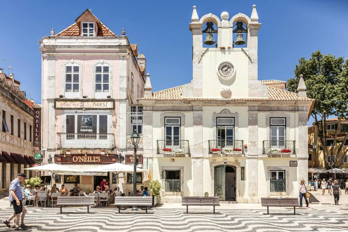 a building with a clock tower in a town square
