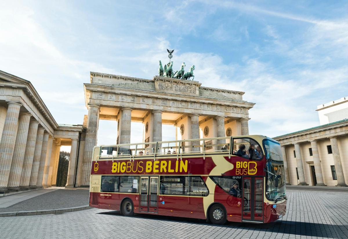 a double decker bus parked in front of a building