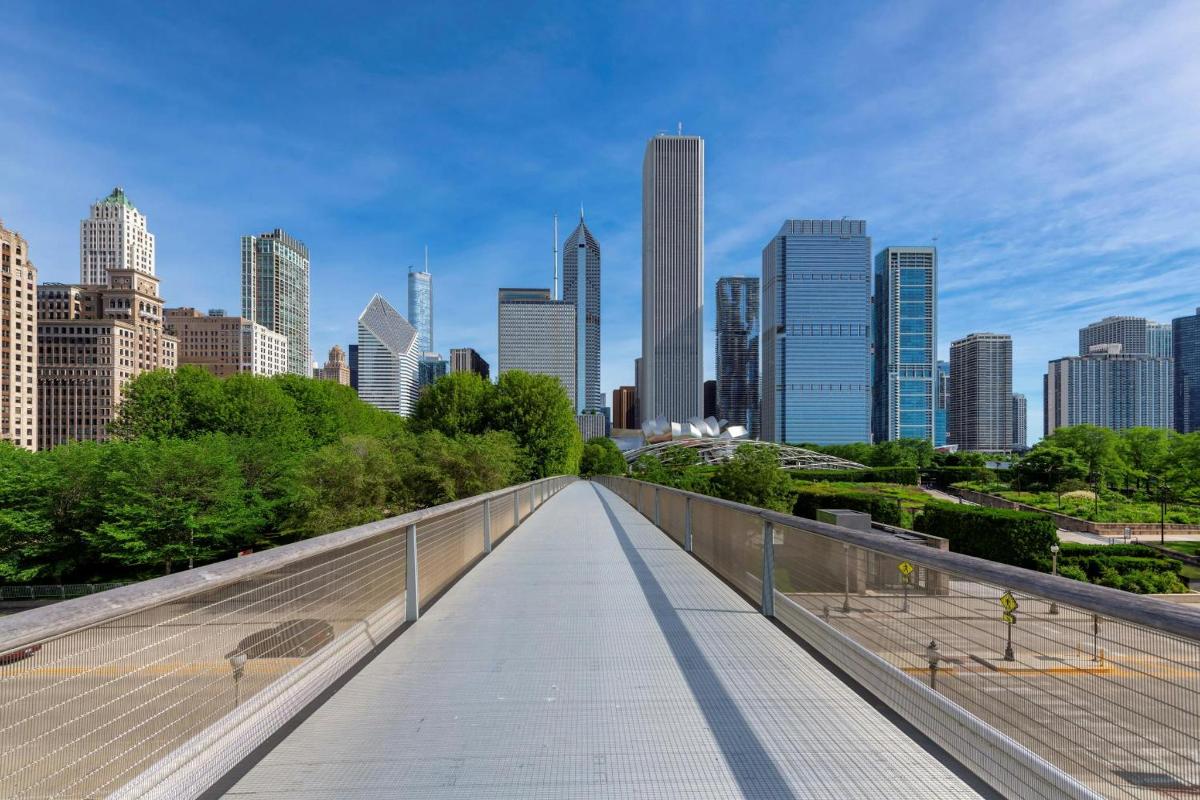 a bridge in a city with tall buildings