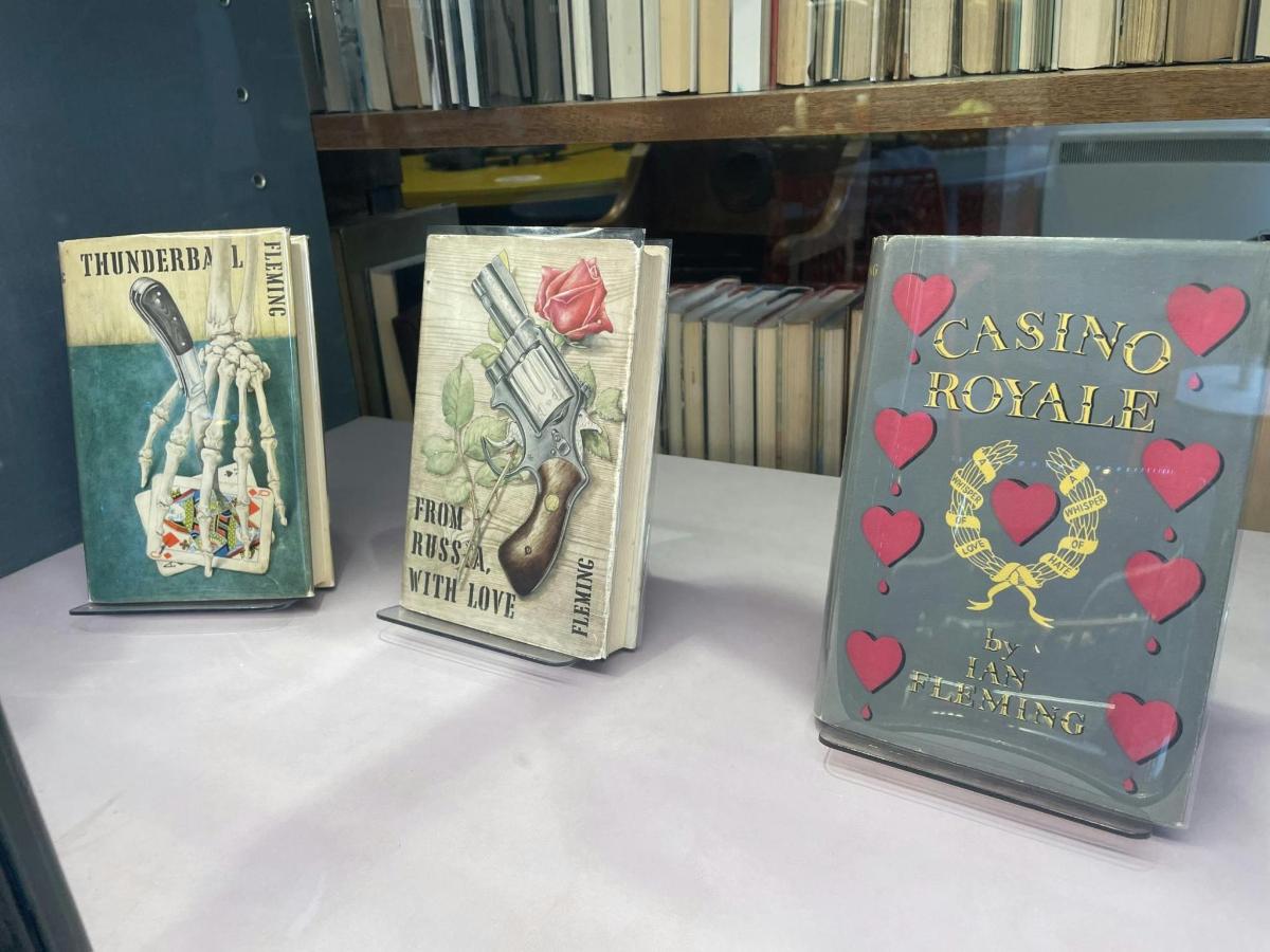 three books are sitting on a shelf
