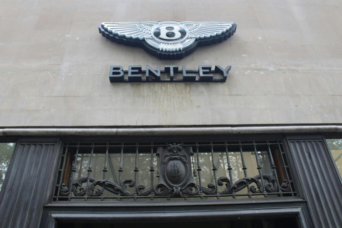 a sign on the side of a building with a bmw sign