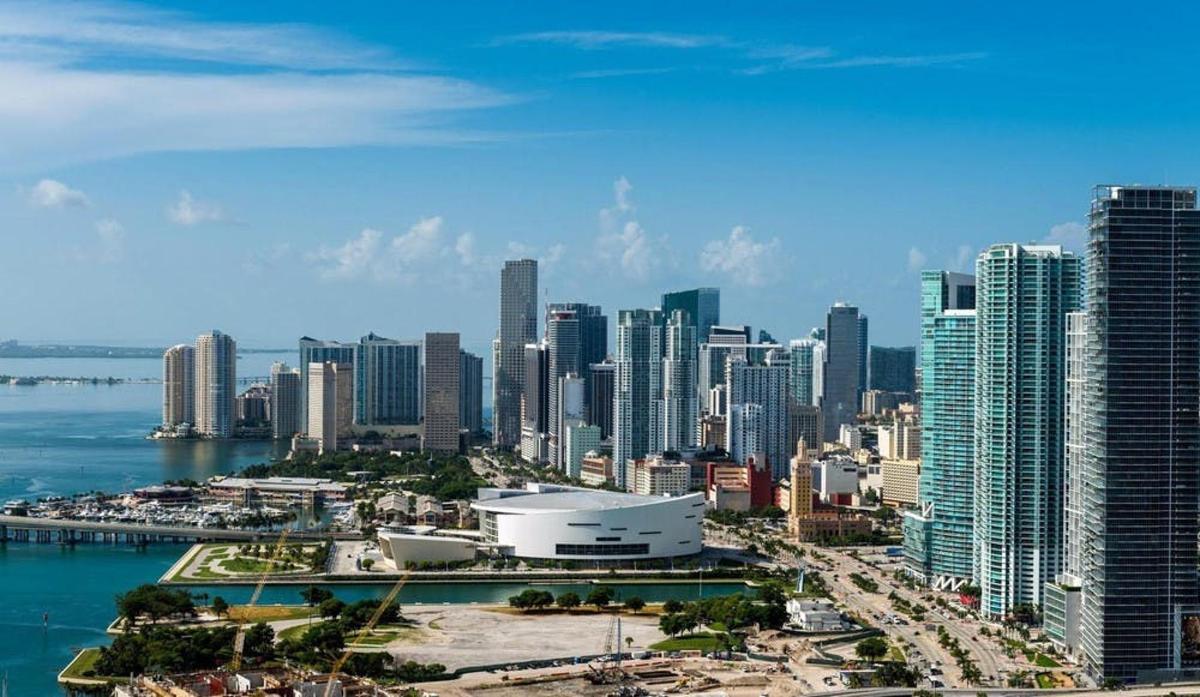 an aerial view of a city with tall buildings
