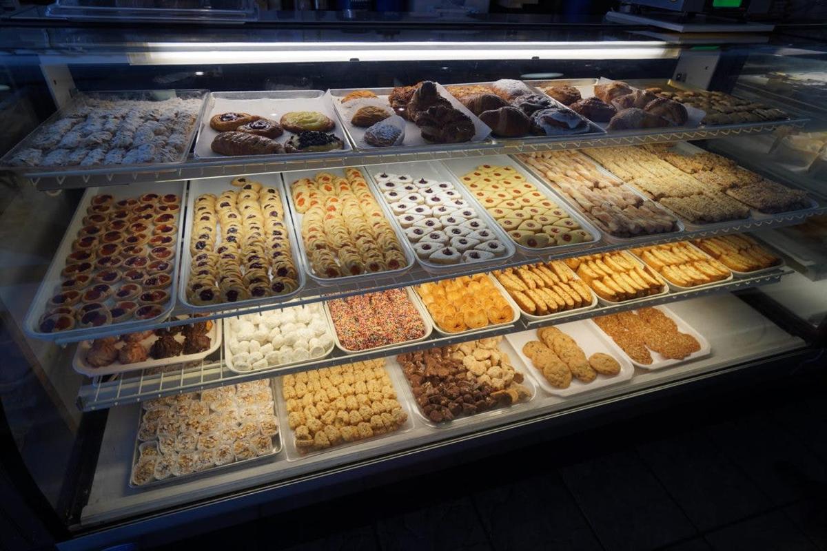 a display case filled with lots of different donuts