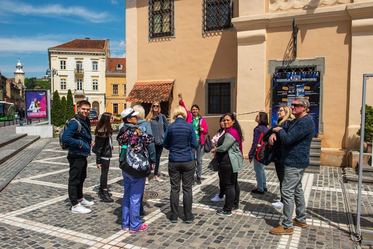 a group of people standing outside of a building