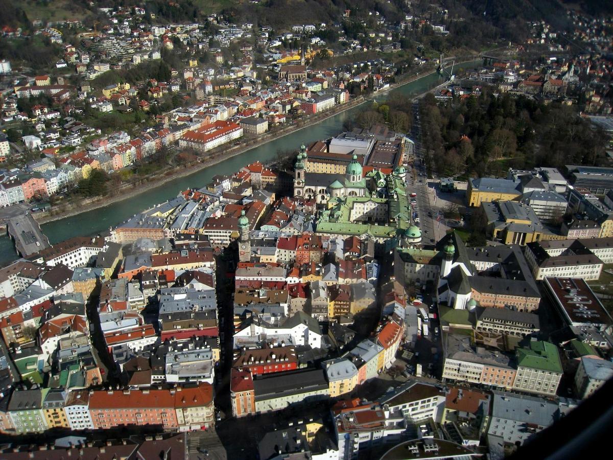 an aerial view of a city with a river