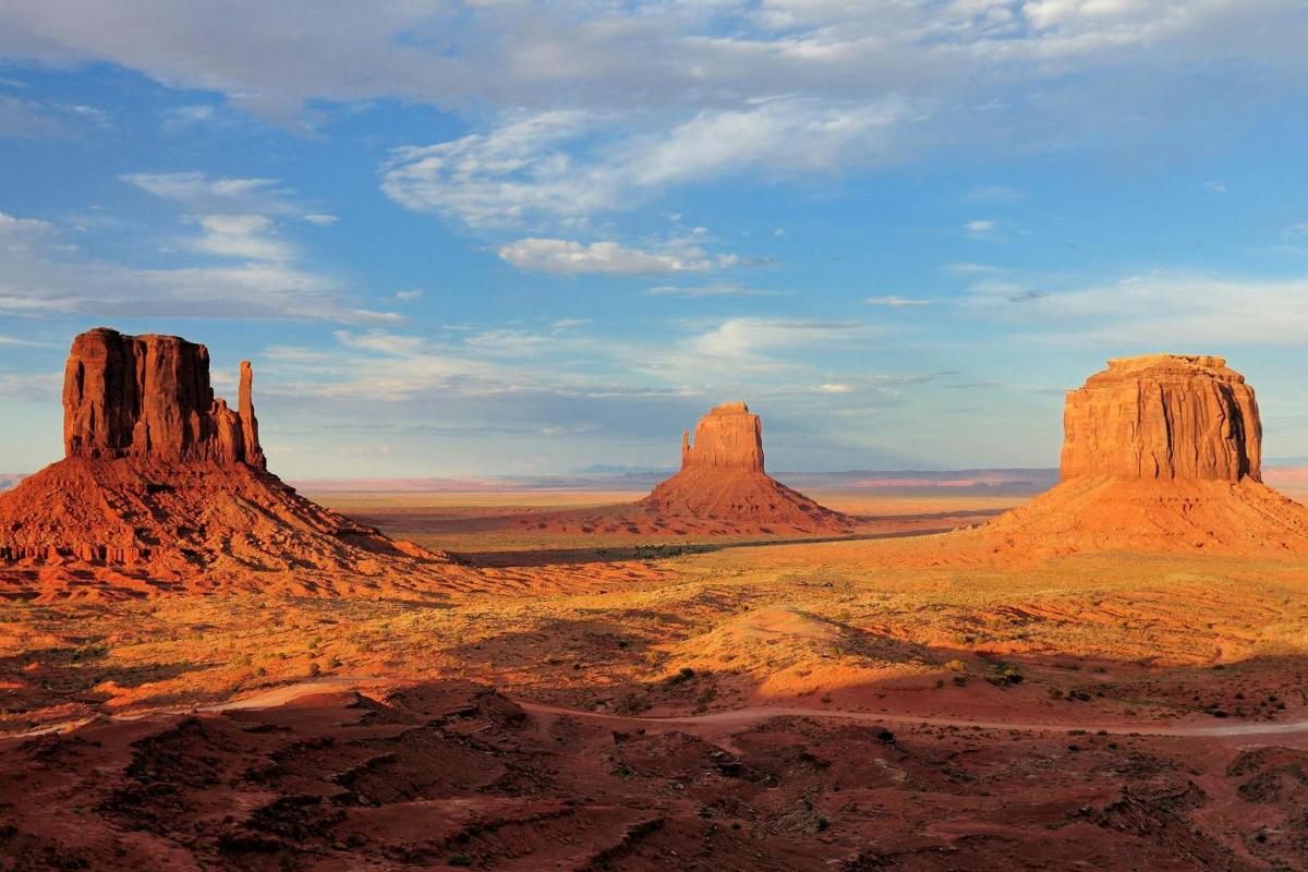 a view of the desert with rock formations