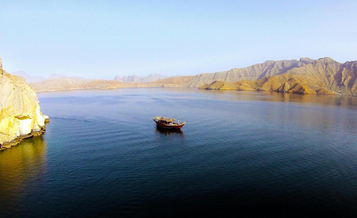 a boat in the middle of a large body of water