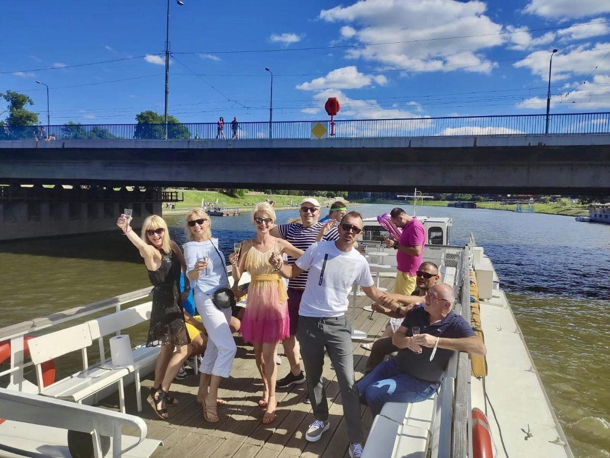 a group of people on a boat on the river