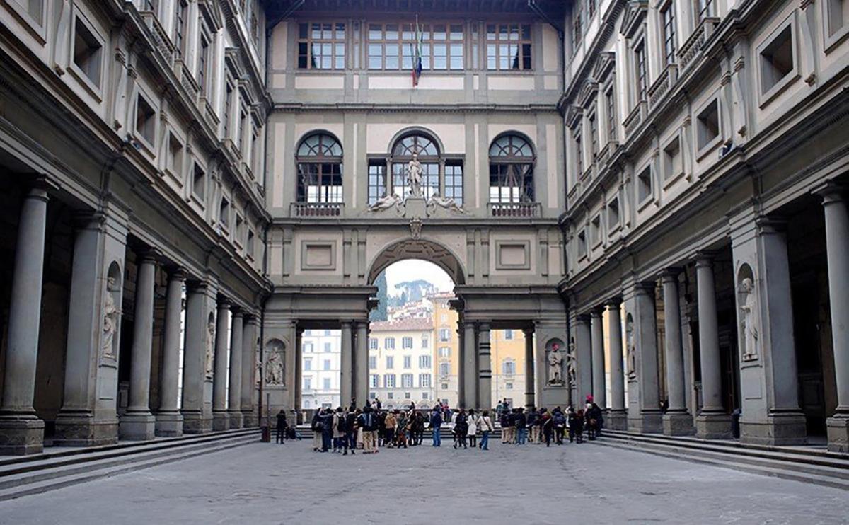 a group of people standing in a large building