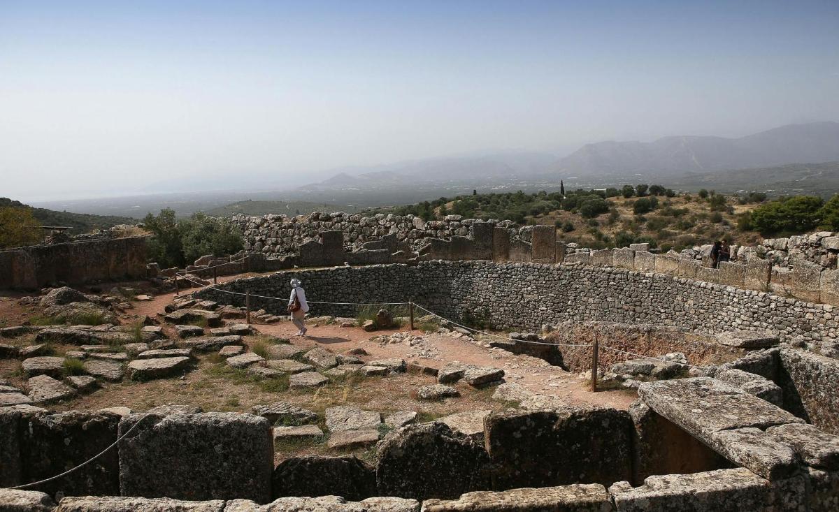 a person standing on top of a ruins
