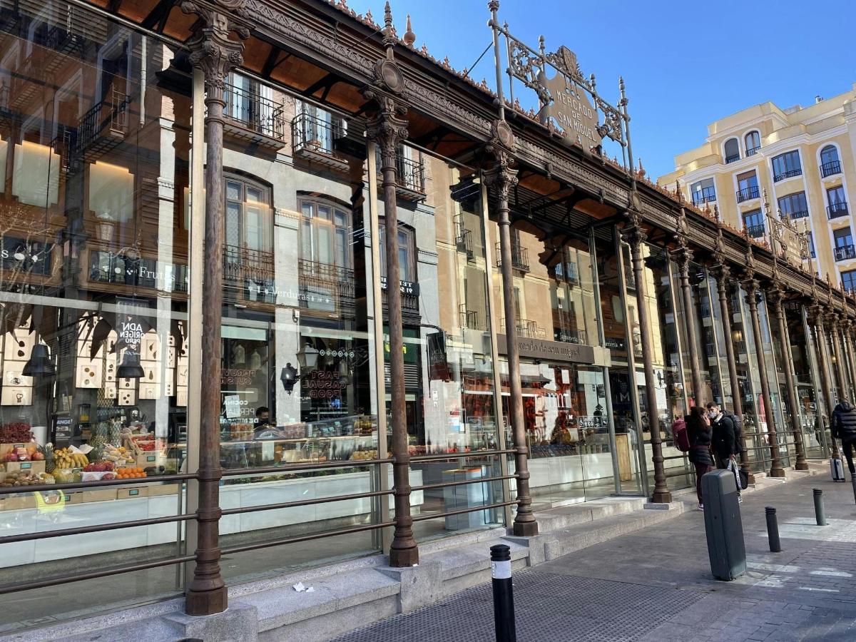 a store front of a building with people walking past it