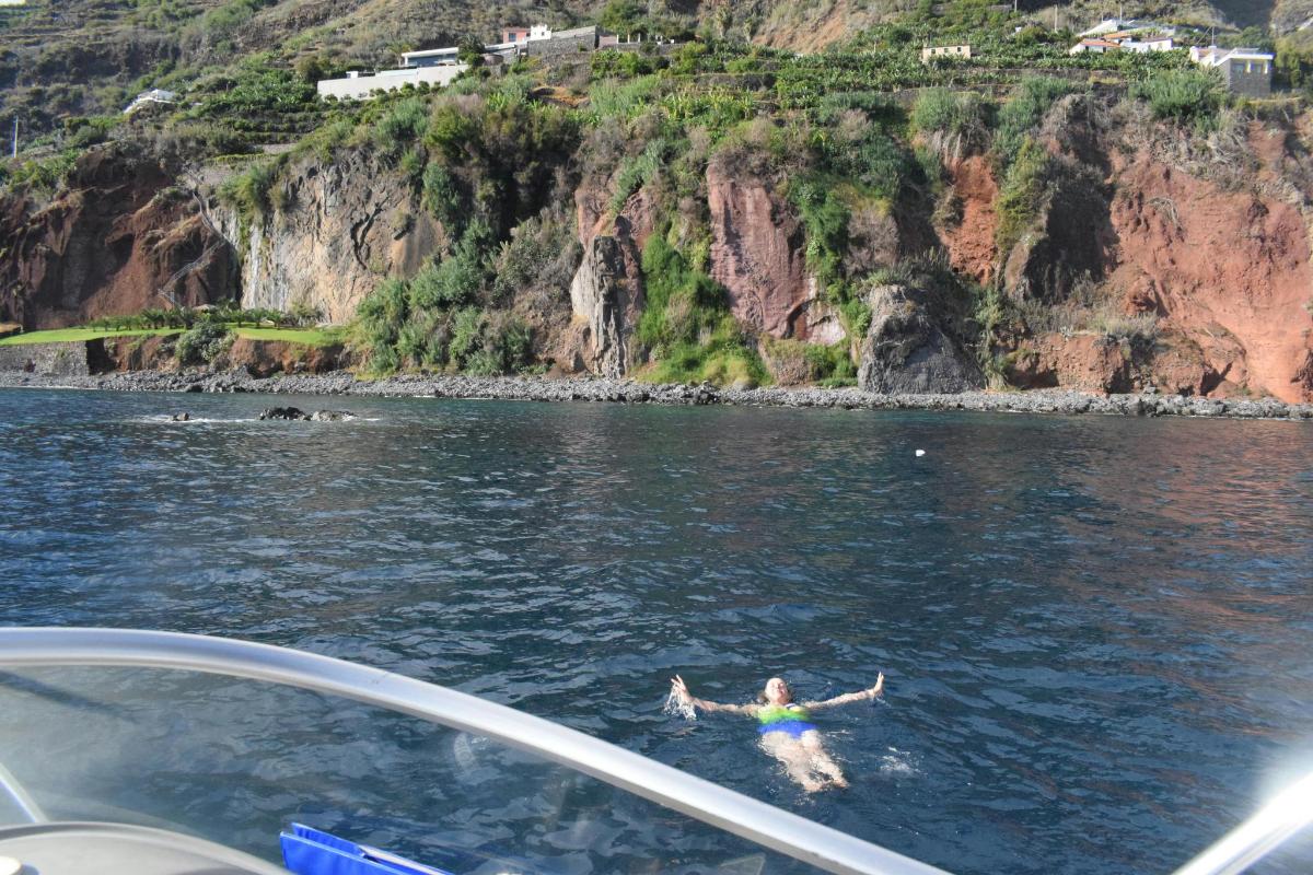 a person swimming in the water on a boat