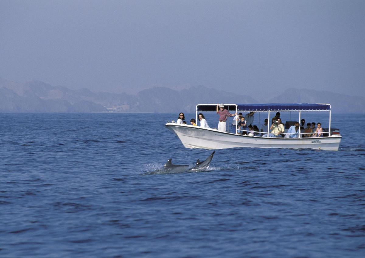 a group of people on a boat in the water