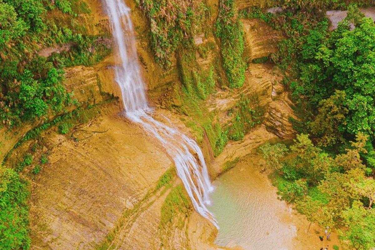 an aerial view of a waterfall and a river
