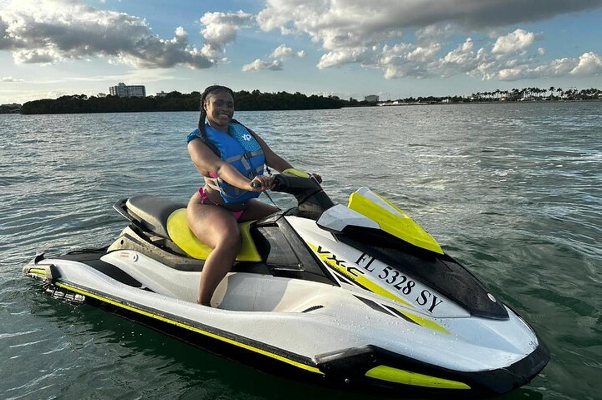 a man is sitting on a jet ski in the water