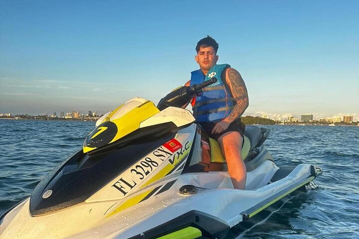 a man is sitting on a jet ski in the water