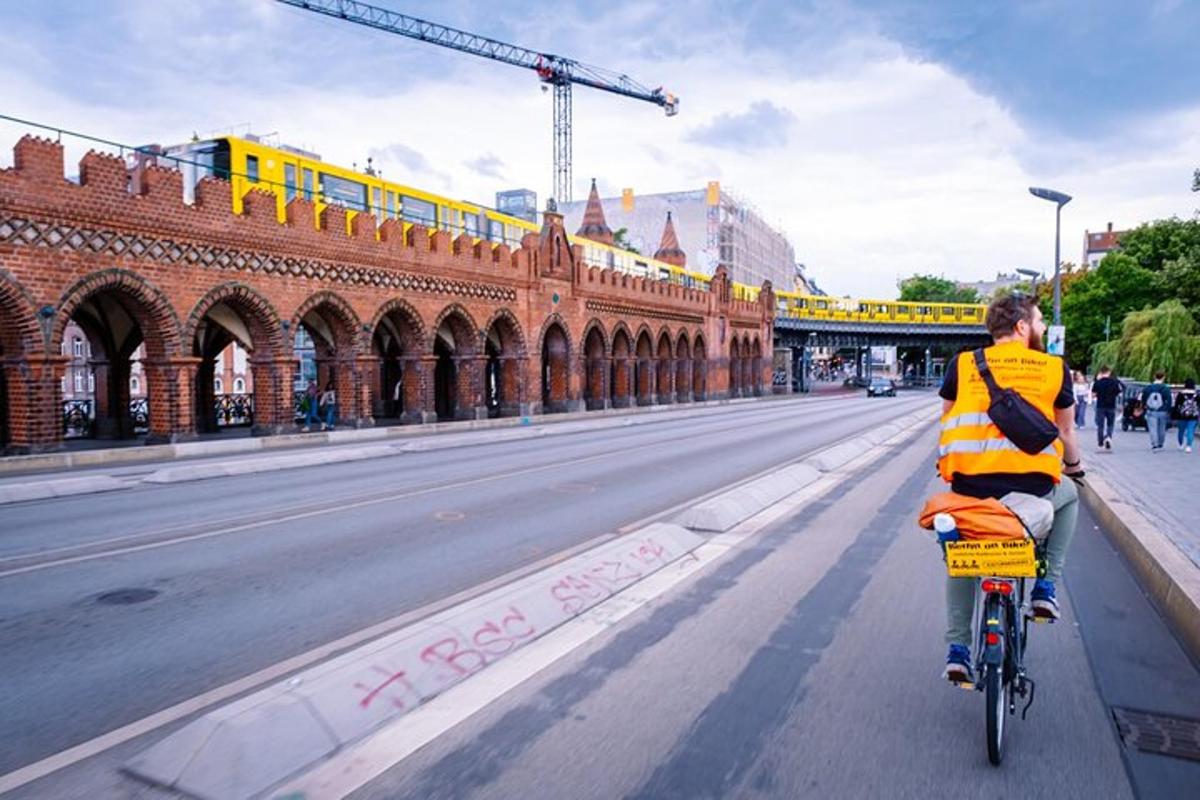 a man is riding a bike down a street