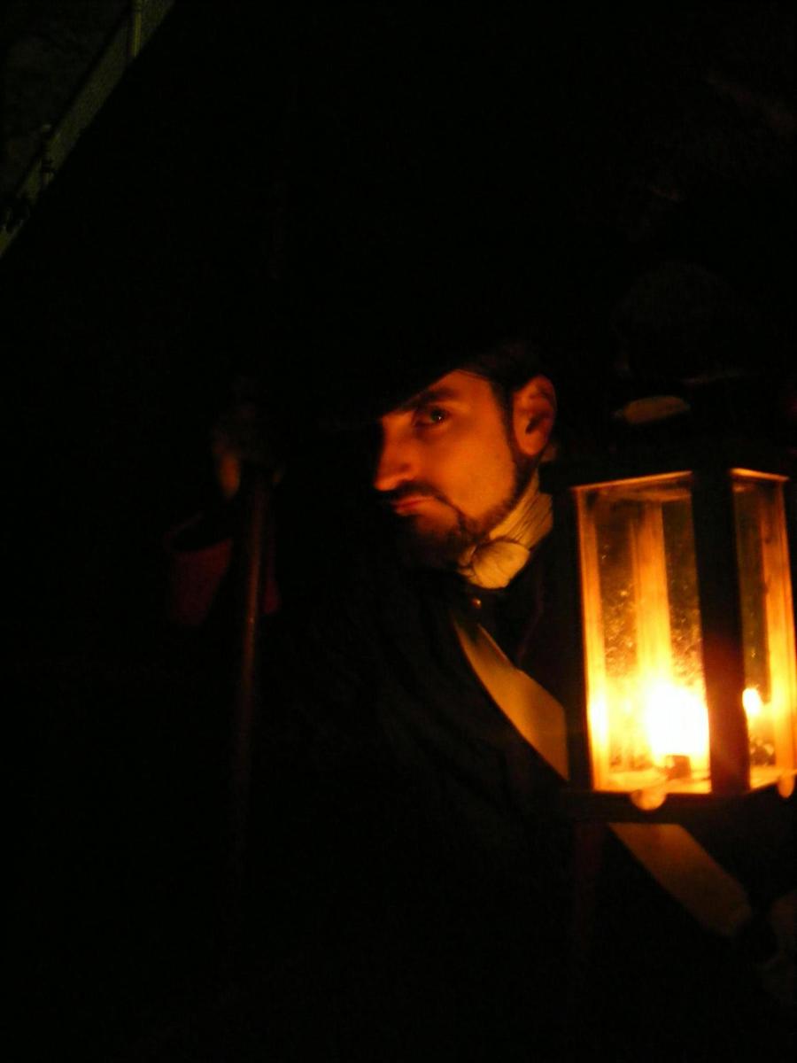 a man is standing in the dark